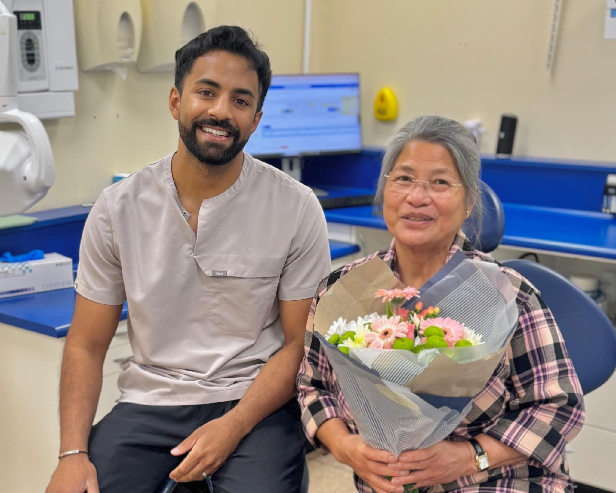 Implant Dentist Dr Nev Jeyakumar with patient after successful whole mouth dental implants treatment including All-on-6 dental implants in Croydon