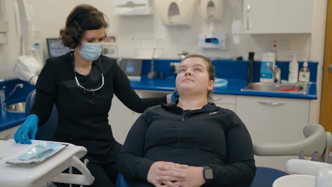 Dentist supporting a nervous patient during a calm dental appointment at Foxley Lane Dental in Purley