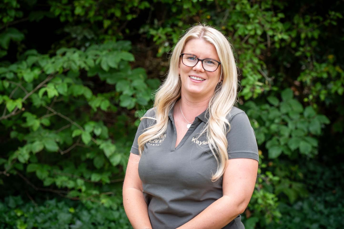 Front of house Kayleigh smiling outdoors at Foxley Lane Dental Clinic, representing the experienced team providing SmileFast treatment in Purley