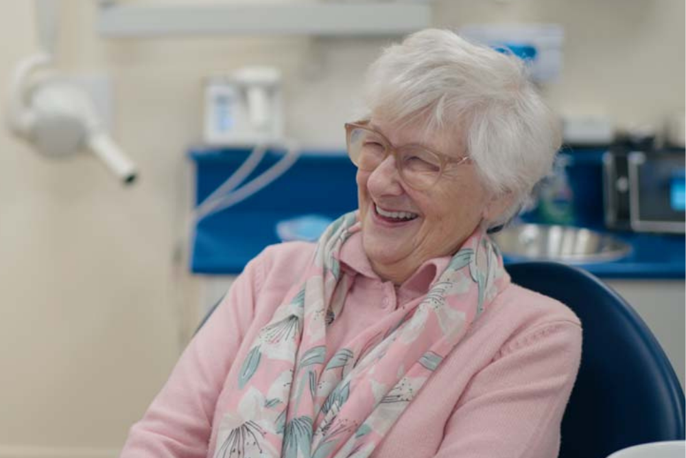 Patient smiling after discussing dental implant treatment at Foxley Lane Dental in Purley