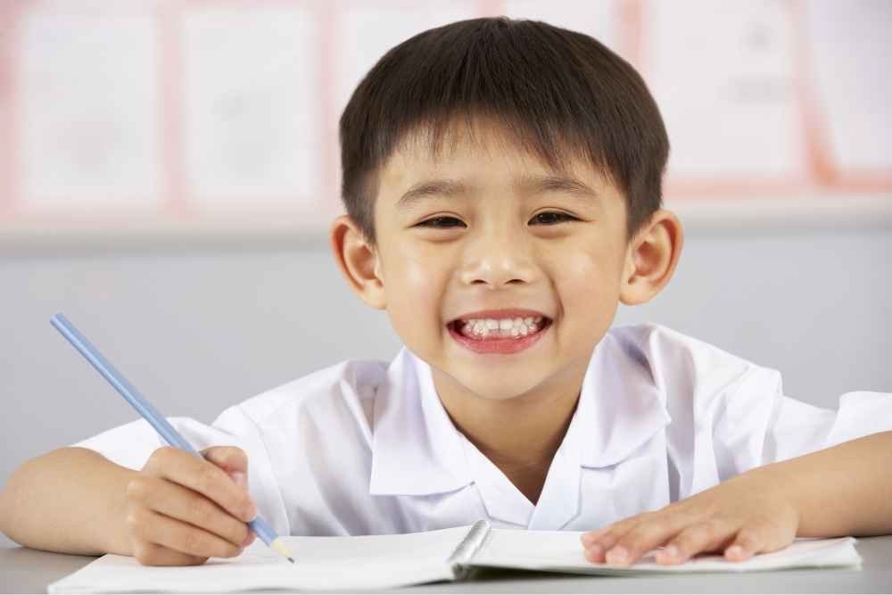 School child smiling ahead of a children’s dental check-up in Purley