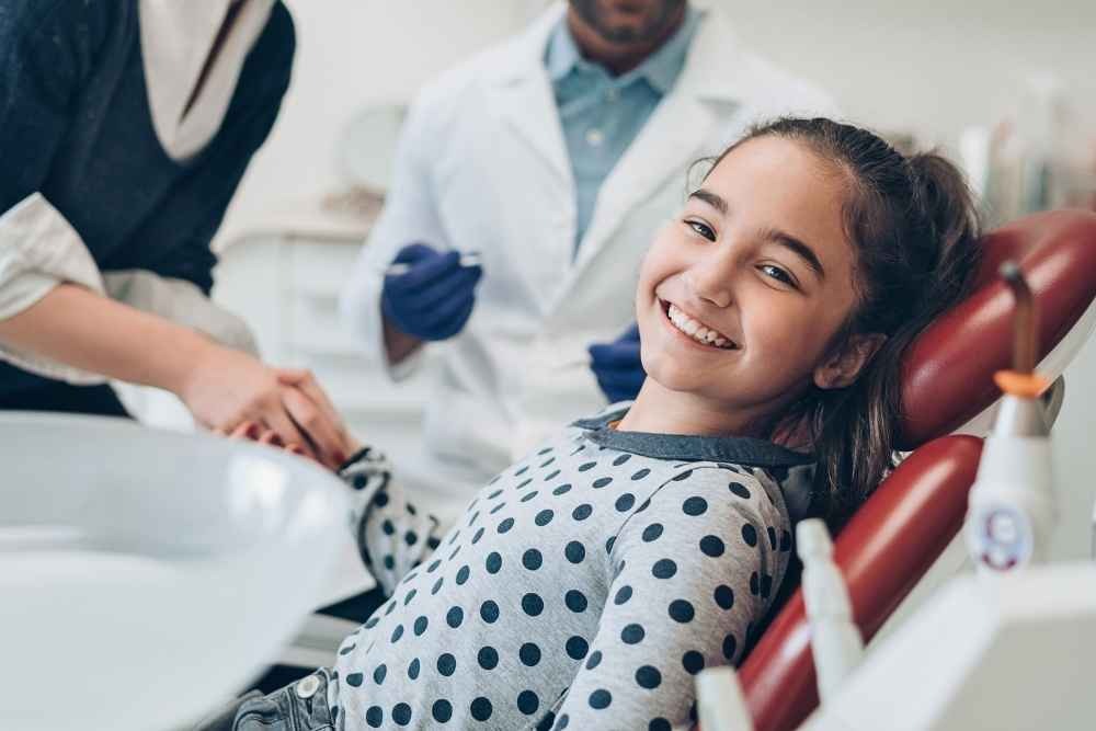 Child relaxed in the dental chair during a children’s dentist appointment