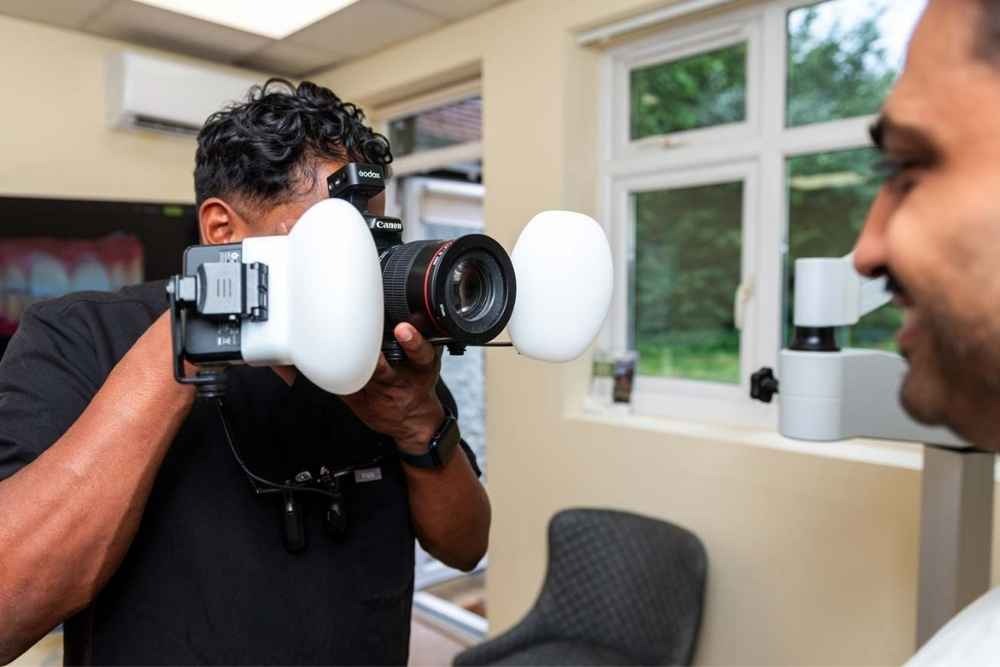 Clinical smile photography during a cosmetic dentistry consultation in Purley