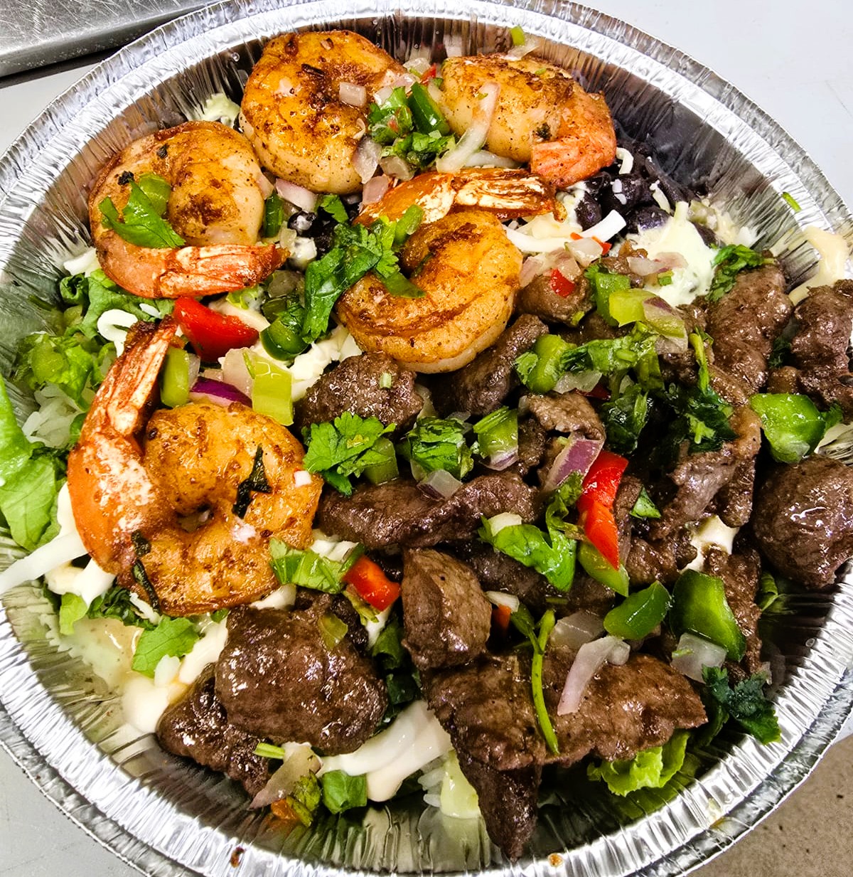 Supreme surf and turf rice bowl at Empanadas and More in Morrisville, NC.