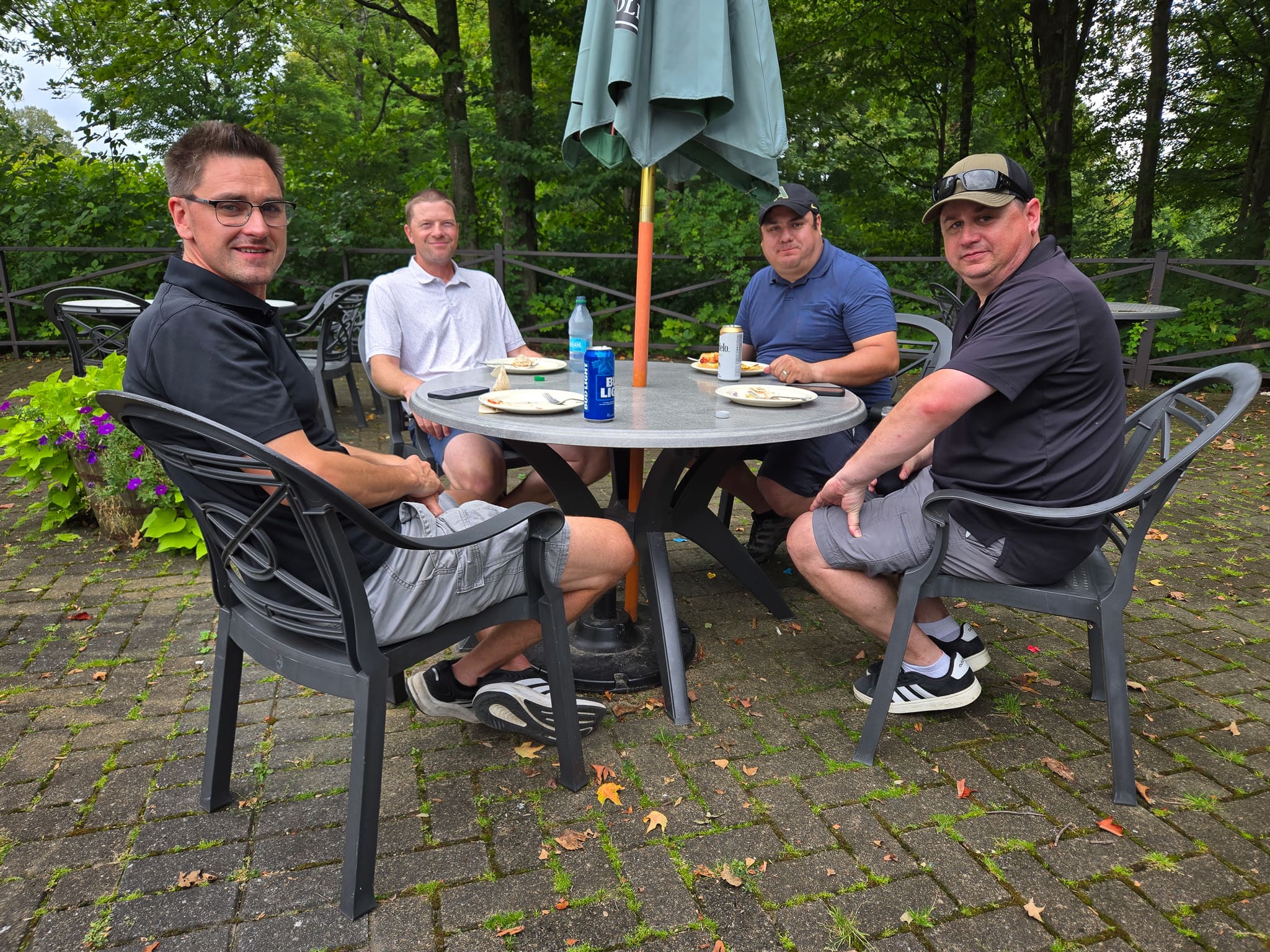 Group sitting at a table at golf course