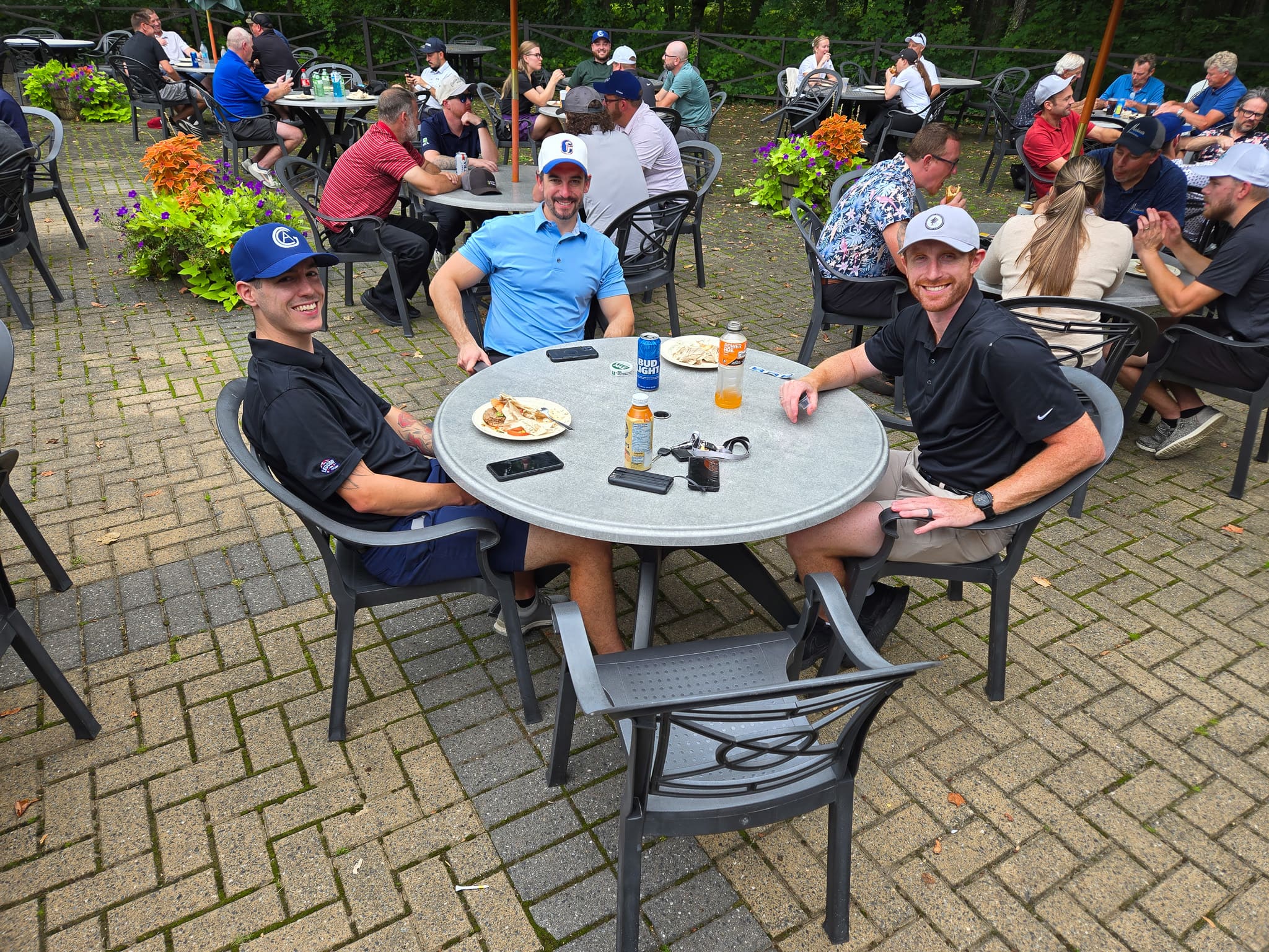 Group sitting at a table at golf course