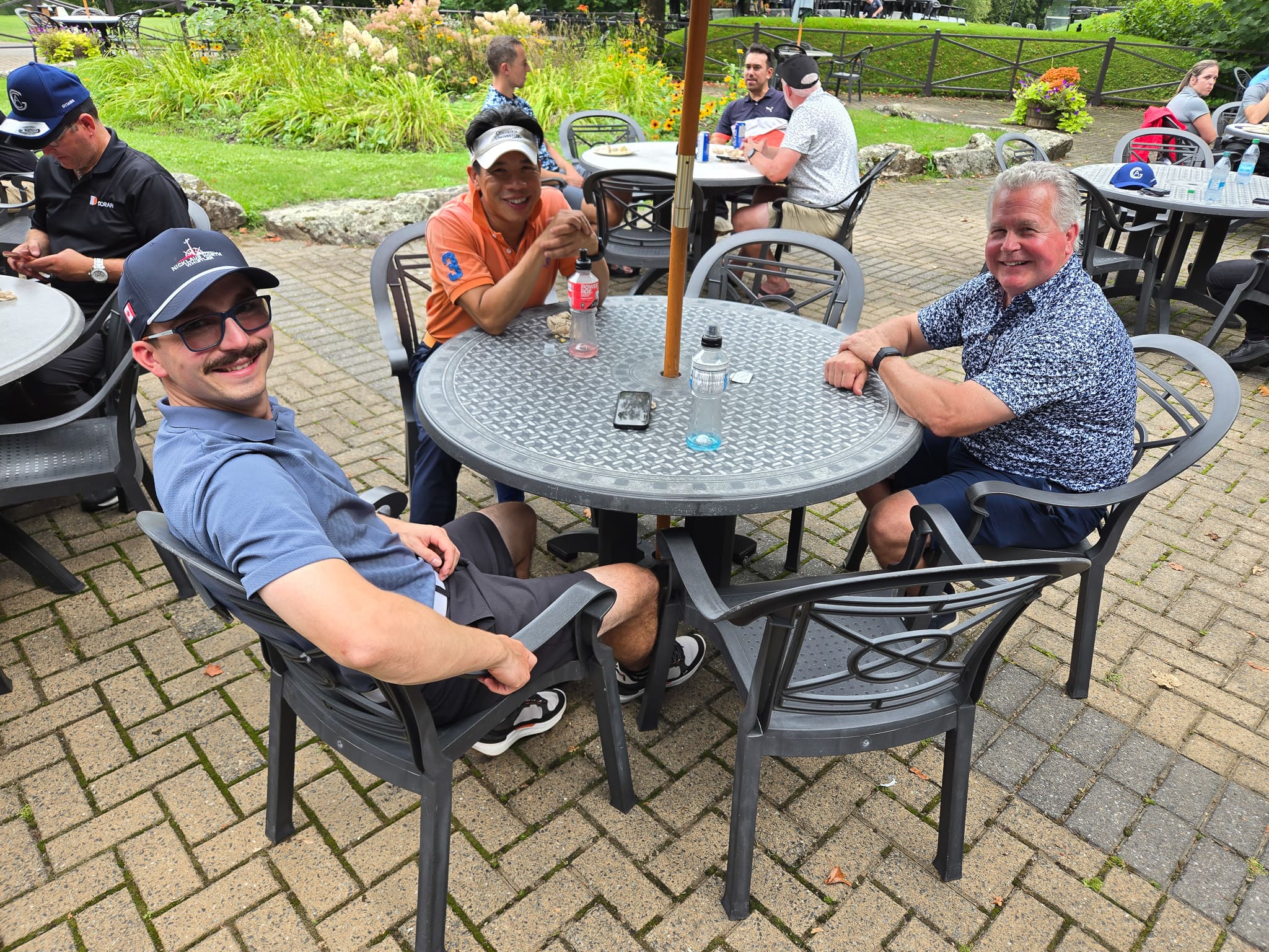 Group sitting at a table at golf course