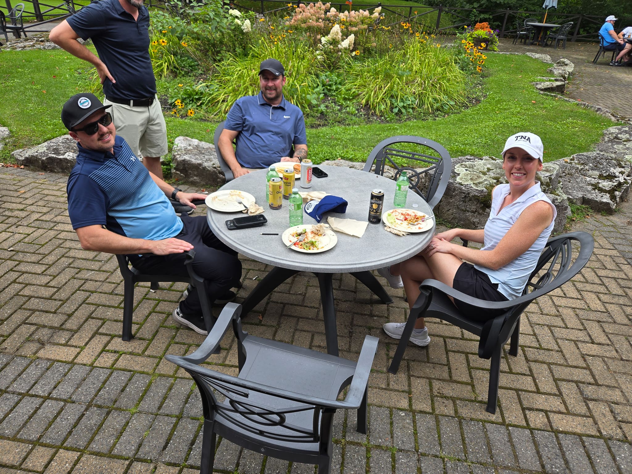Group sitting at a table at golf course