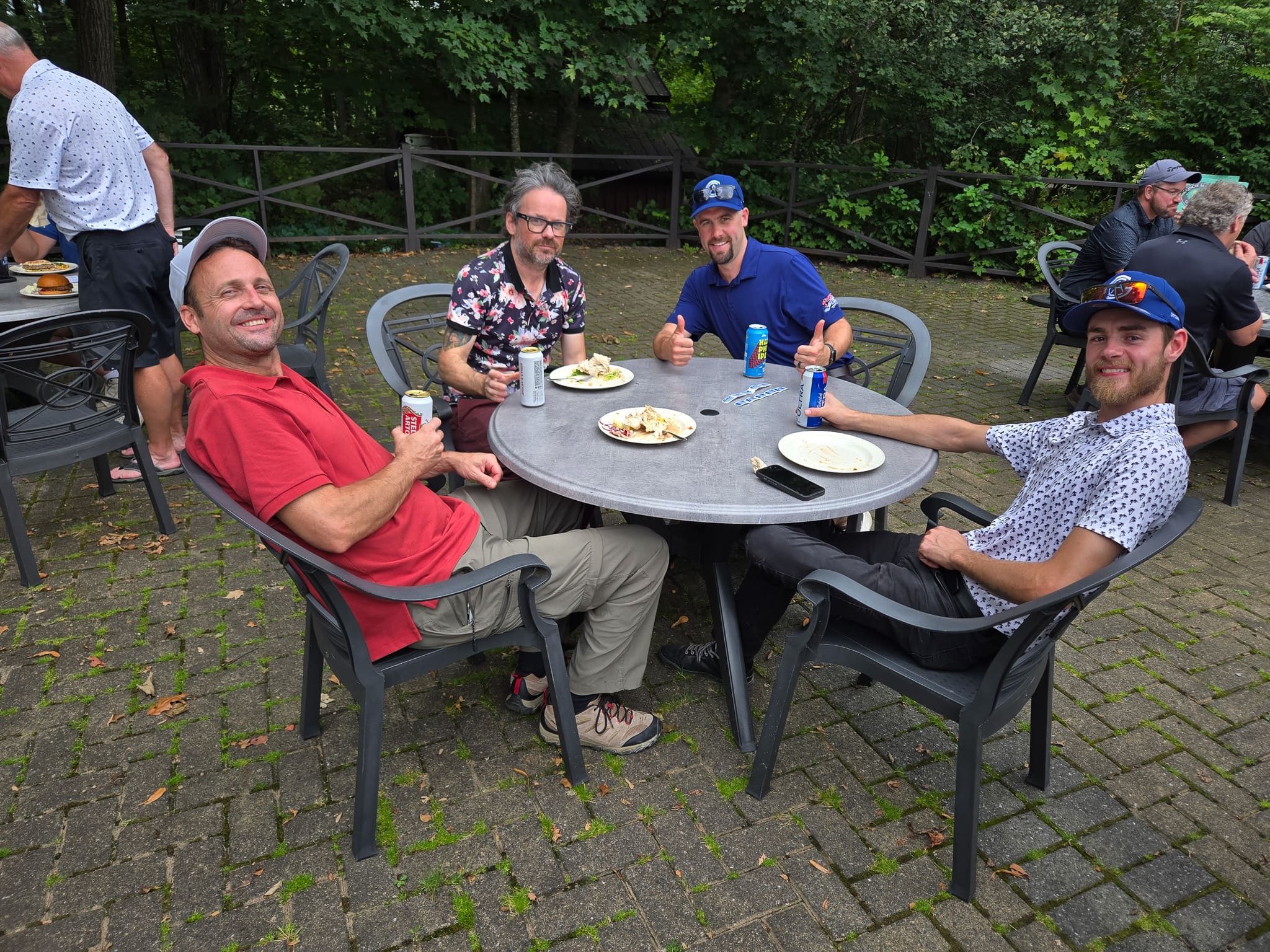 Group sitting at a table at golf course