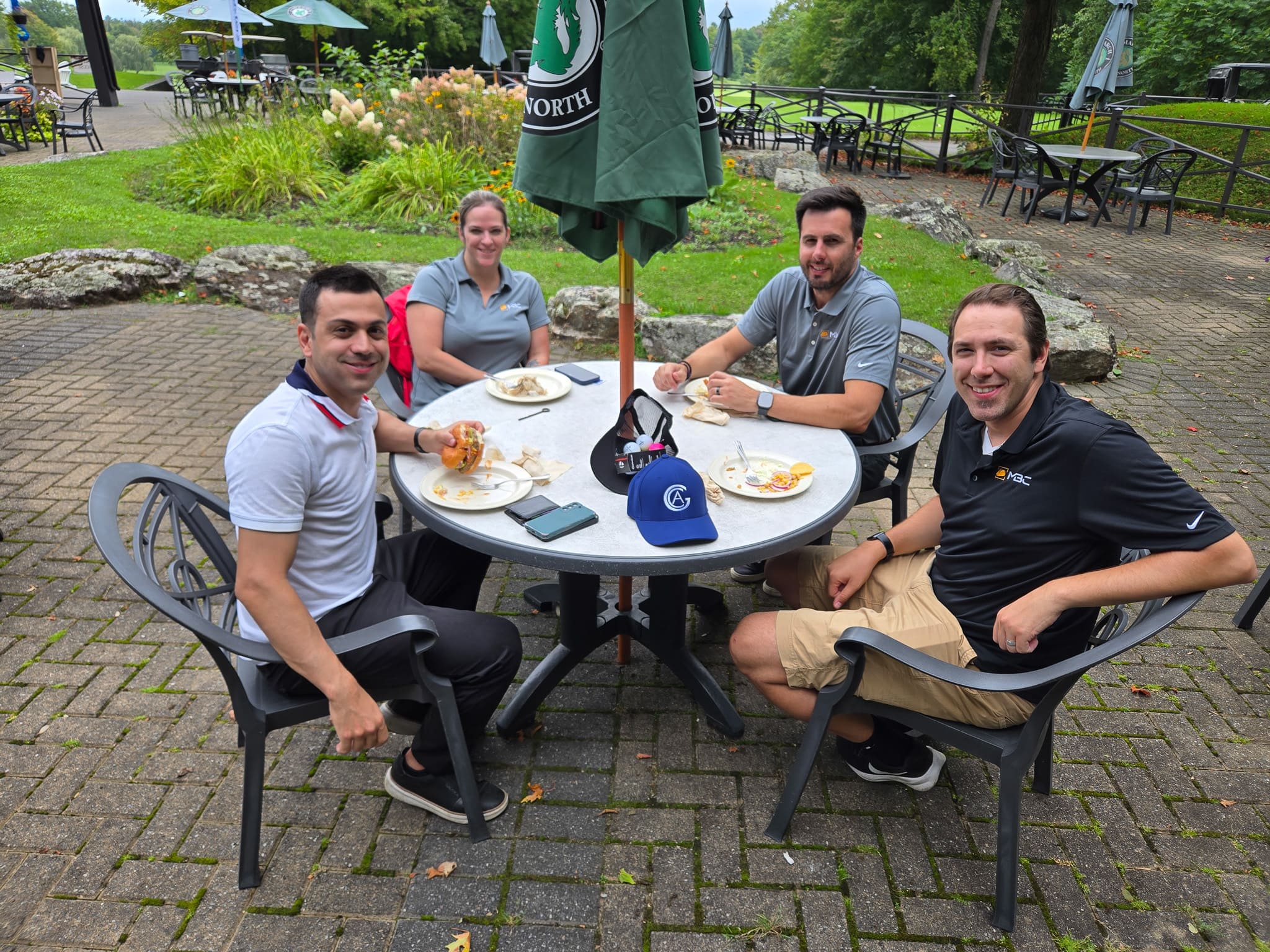 Group sitting at a table at golf course