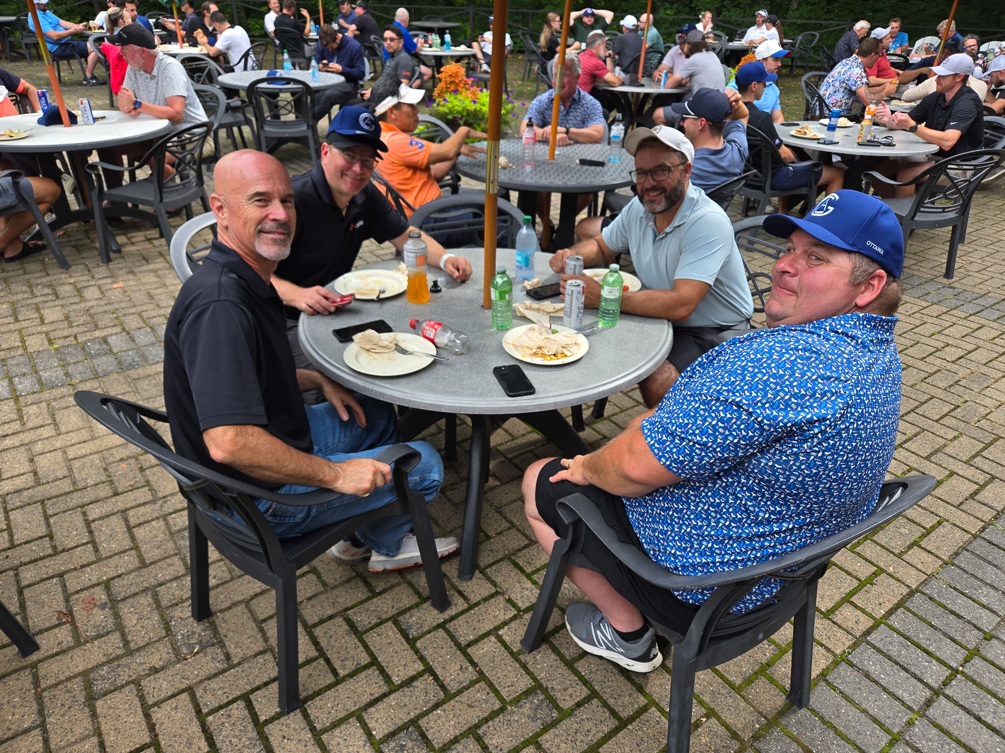 Group sitting at a table at golf course