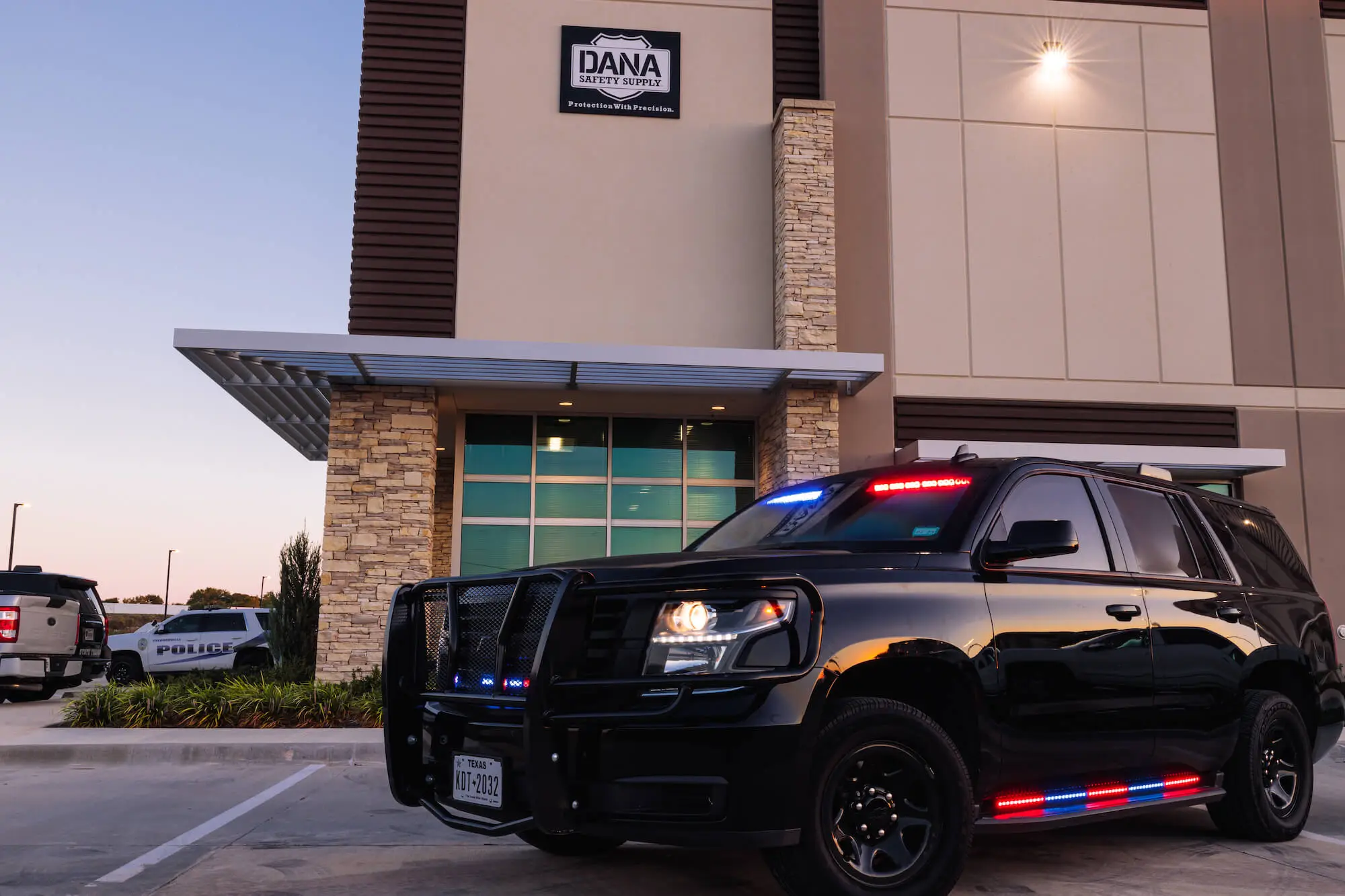 Police cruiser idling at a building