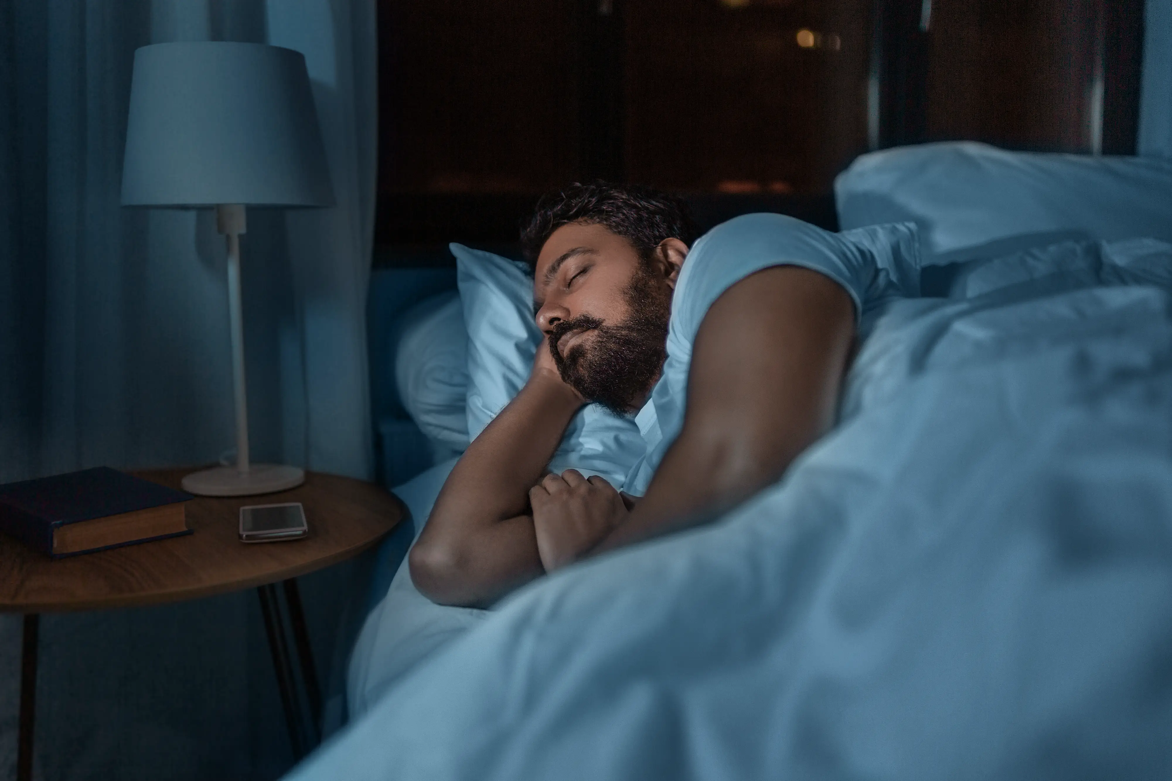 Man sleeping peacefully in bed