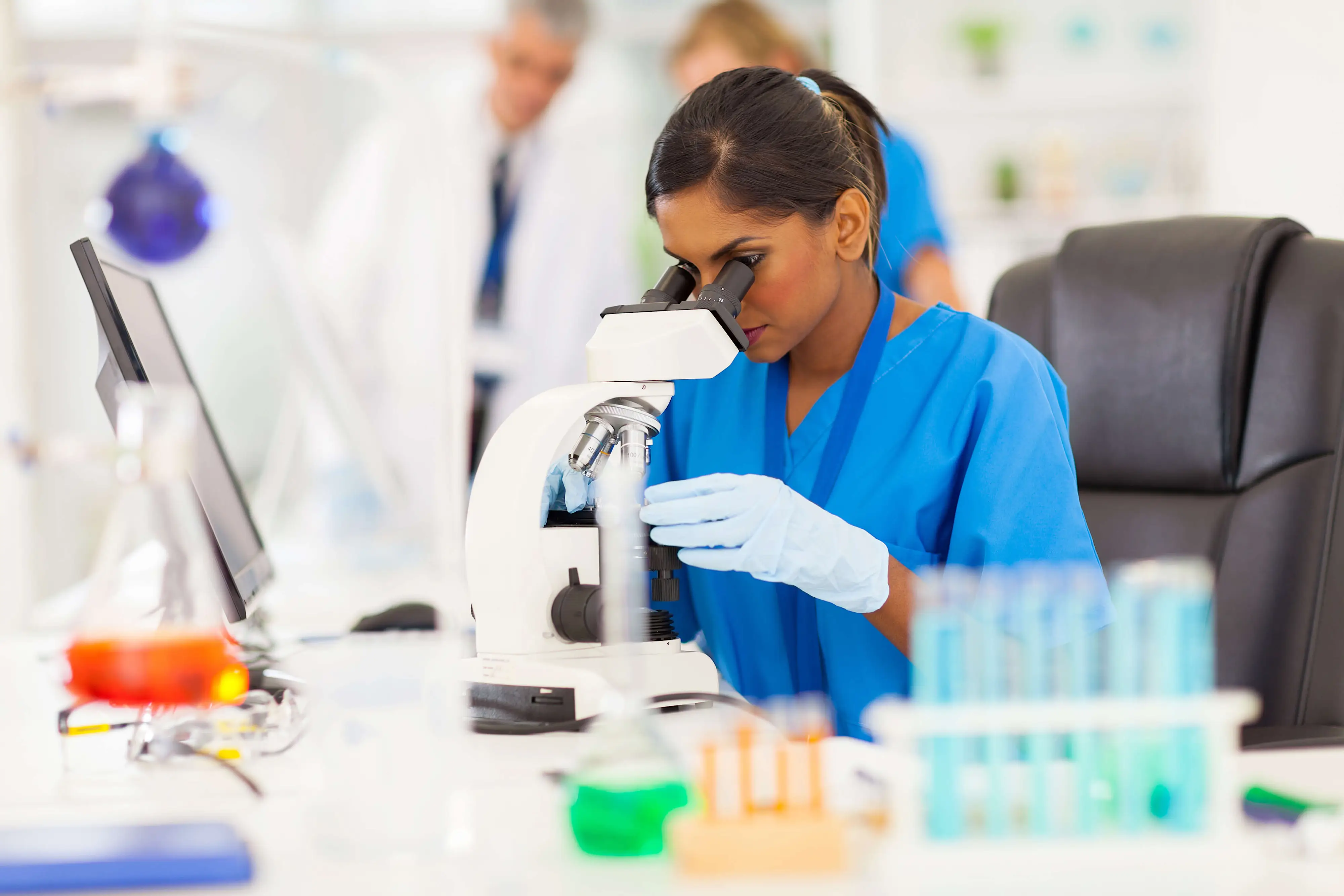Woman in lab analyzing sample