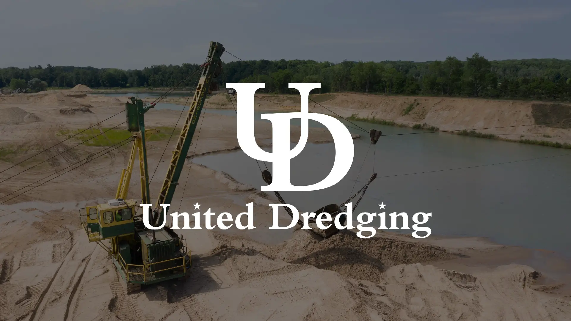 Dredging sand pit with United Dredging's logo