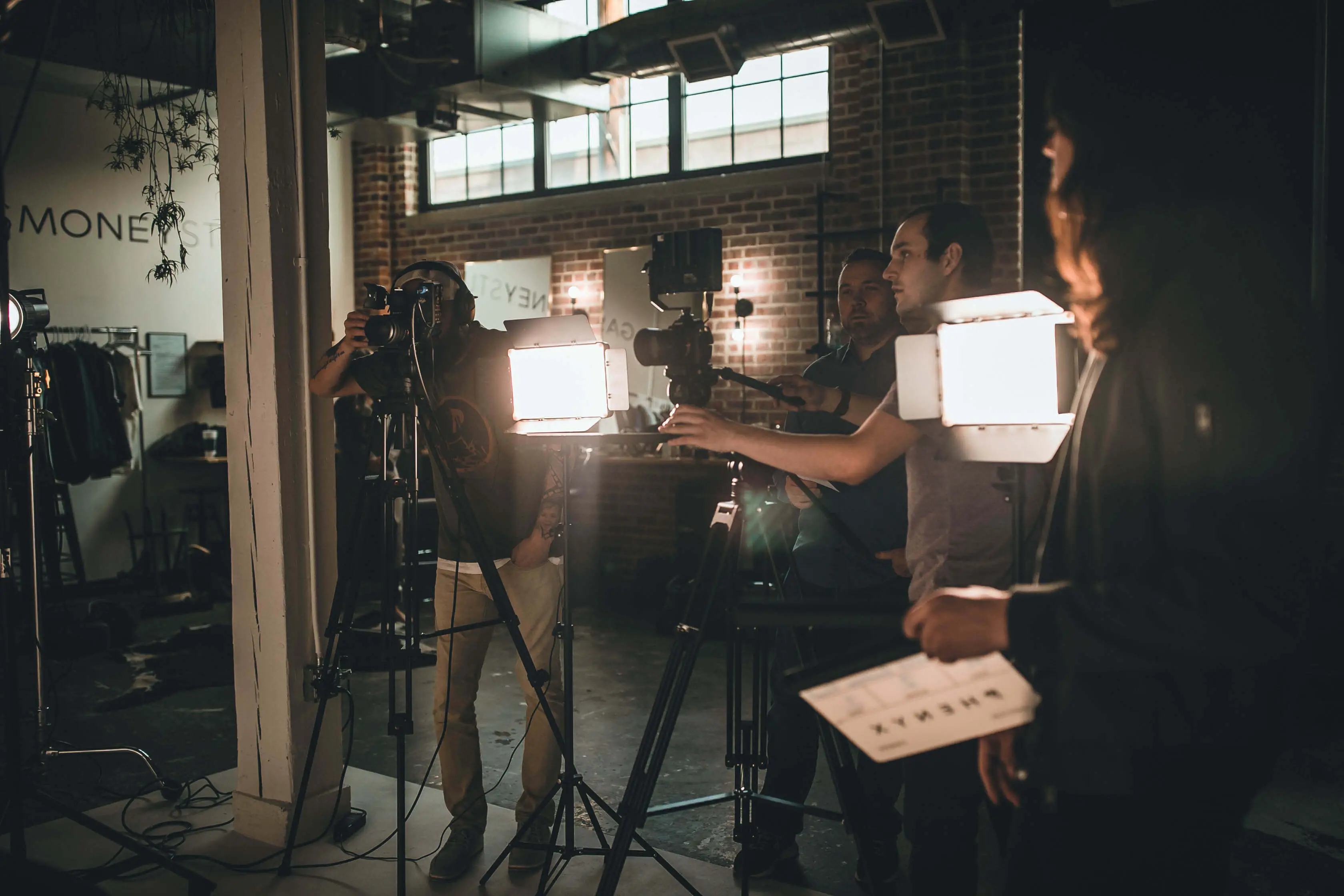 PHENYX in a production studio standing behind cameras