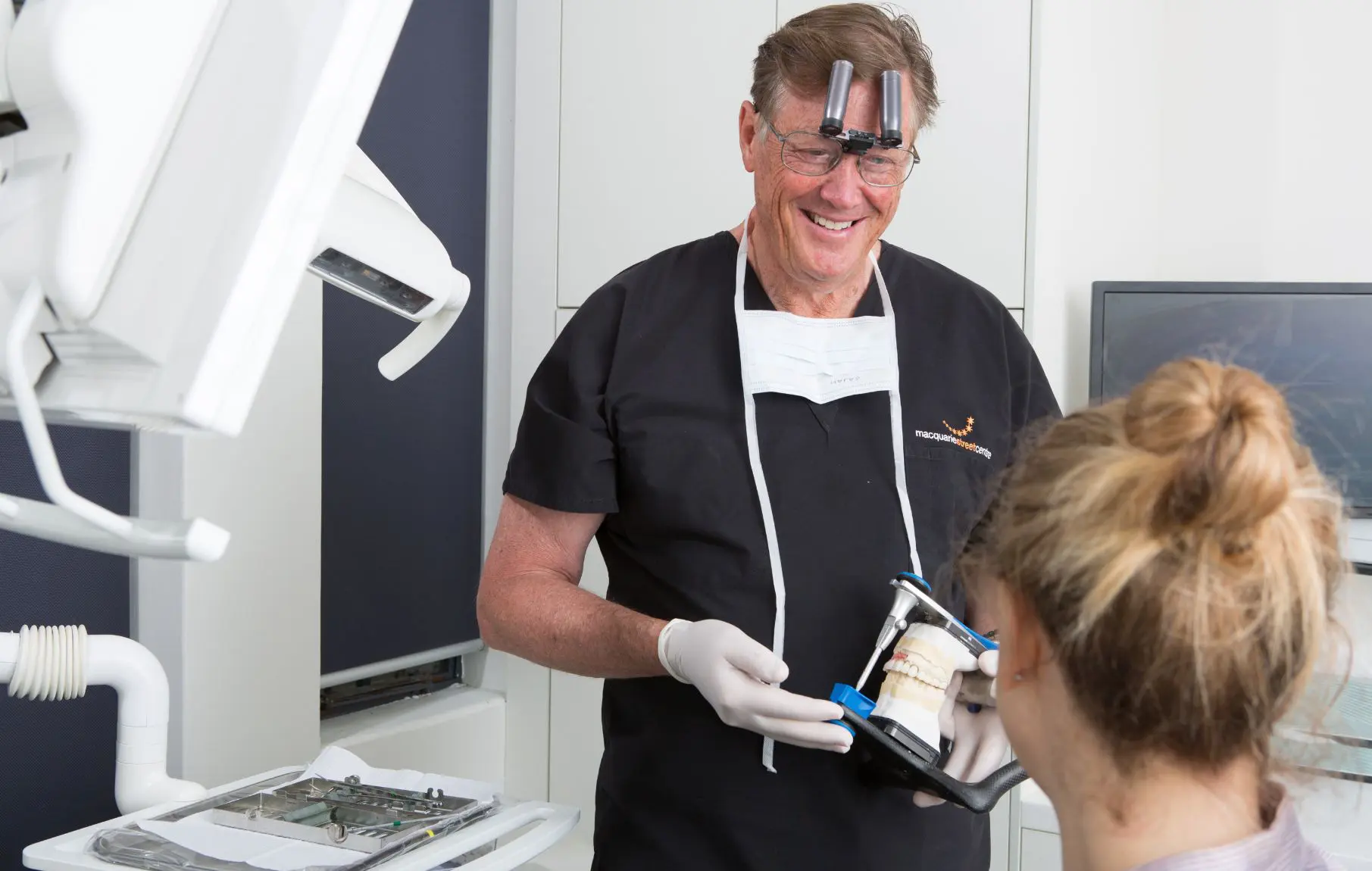 Dr David Dunn discusses the all-on-4 treatment procedure with a patient at Macquarie Street Dental.