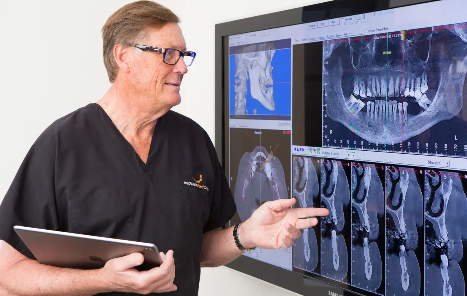 Dr David Dunn analyses the patient scans carefully to advise on the best teeth replacement option.