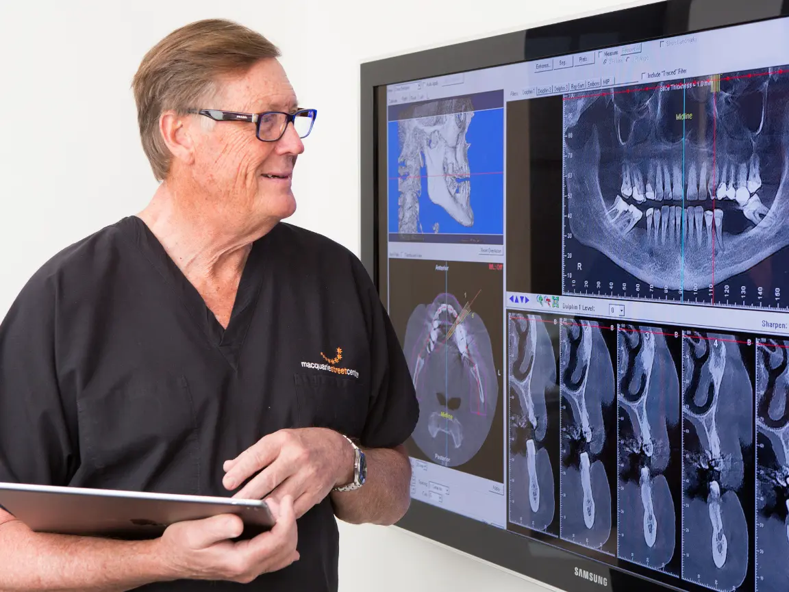 Dr David Dunn carefully plans a dental implant treatment at Macquarie Street Dental.
