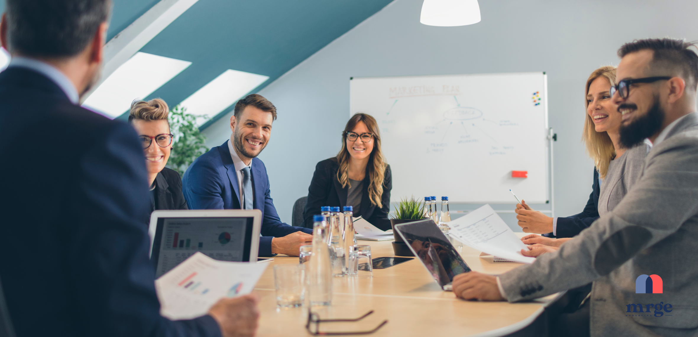 a marketing leader at her desk reviewing reports.