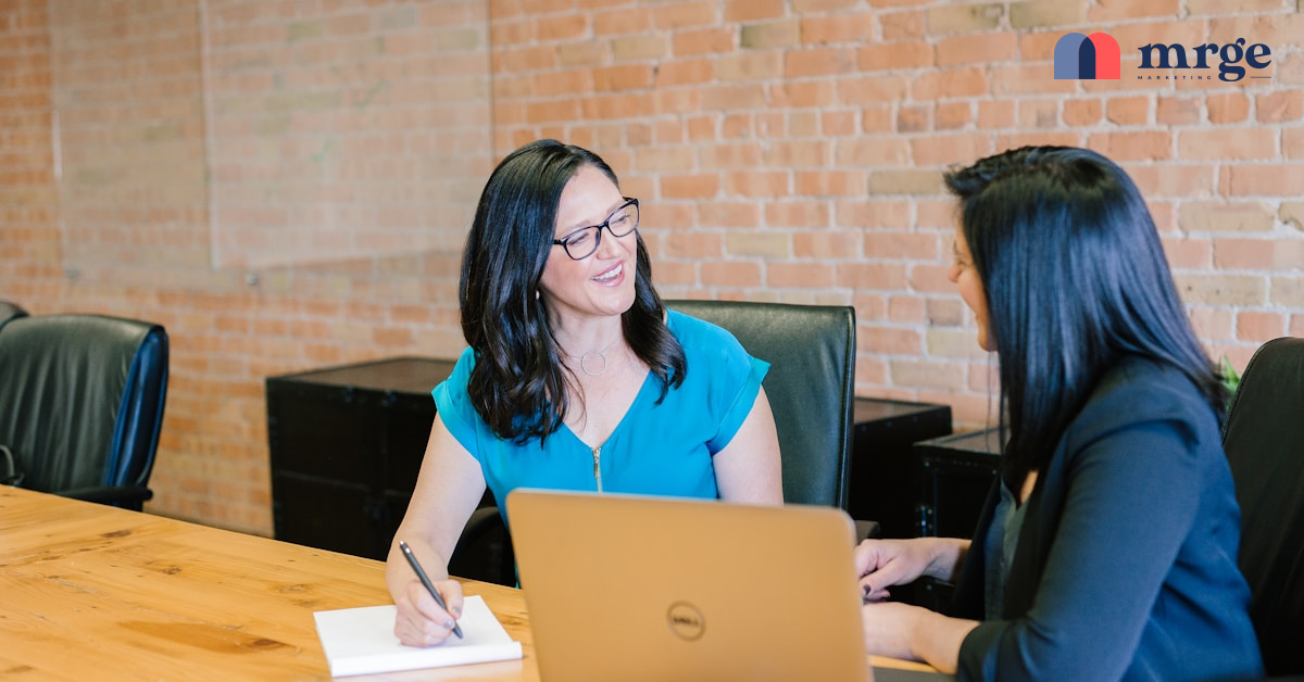 a marketing leader at her desk reviewing reports.