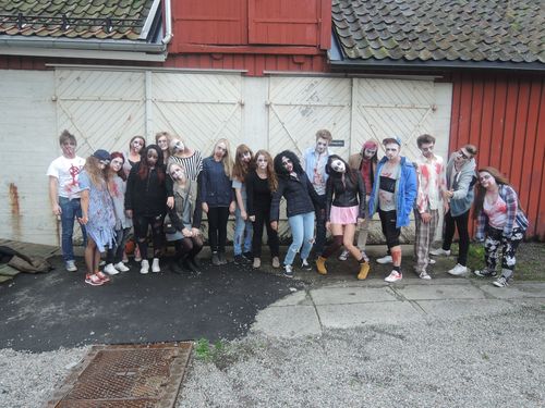 a group of people in costumes posing for a photo