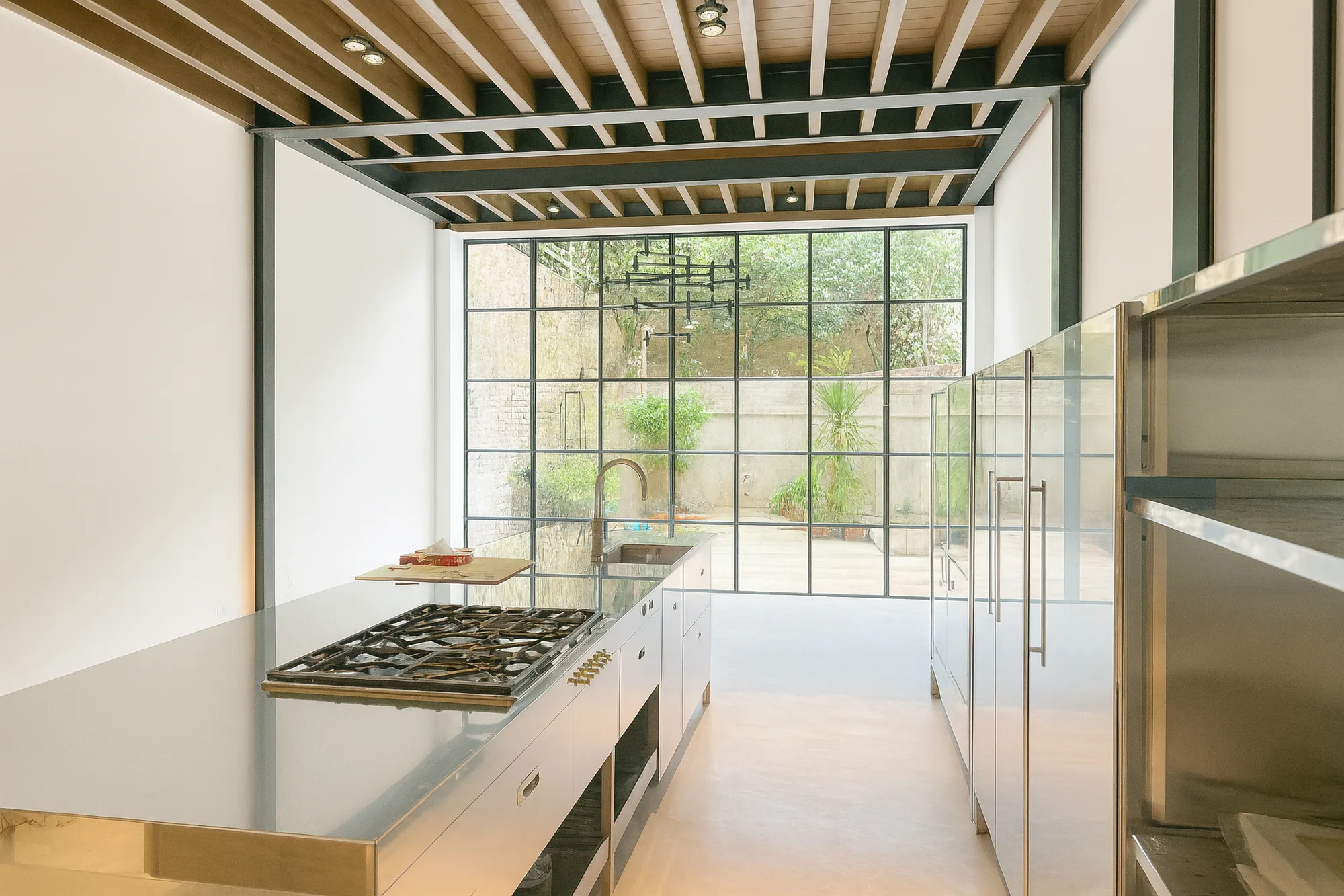 Finished kitchen with stone worktops and integrated appliances
