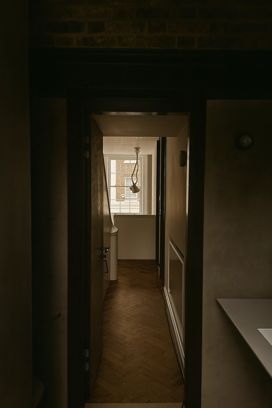 Bathroom with stone details and low-profile ventilation