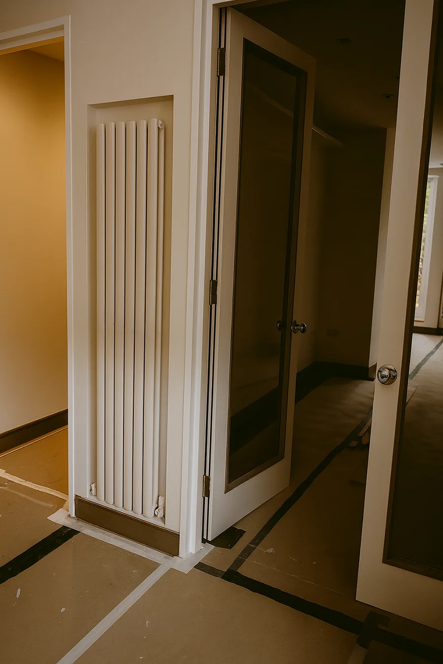 Bathroom with stone details and low-profile ventilation