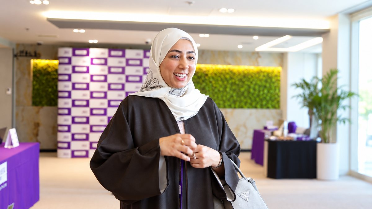 Smiling Global MBA participant at a University of Manchester event