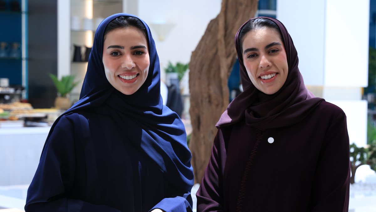 Two Saudi women from the University of Manchester community at a networking event