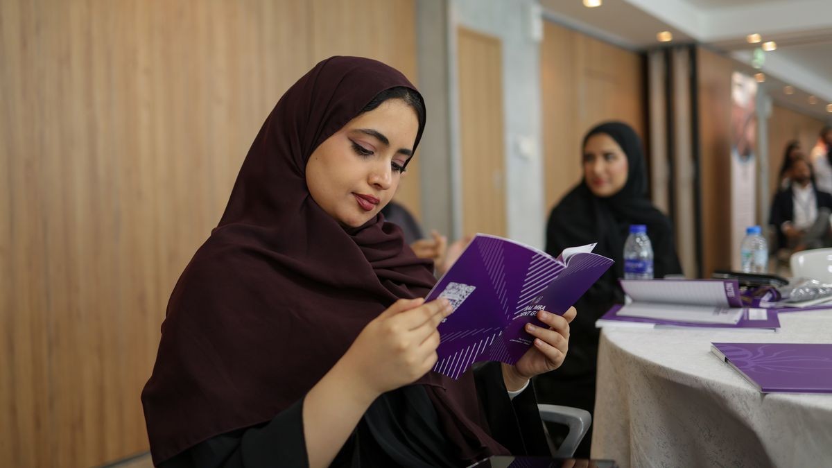 Global MBA participant reading the programme brochure