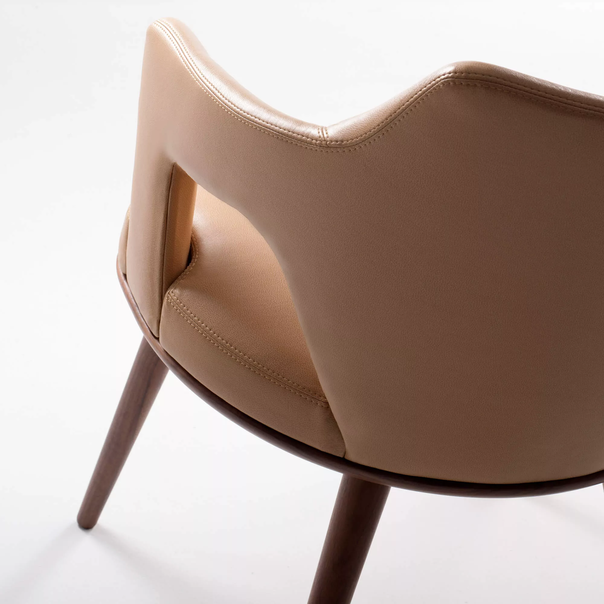 Ultra Fabrics Morgan Porto Promessa chair in caramel upholstery with sculpted back detail and walnut legs