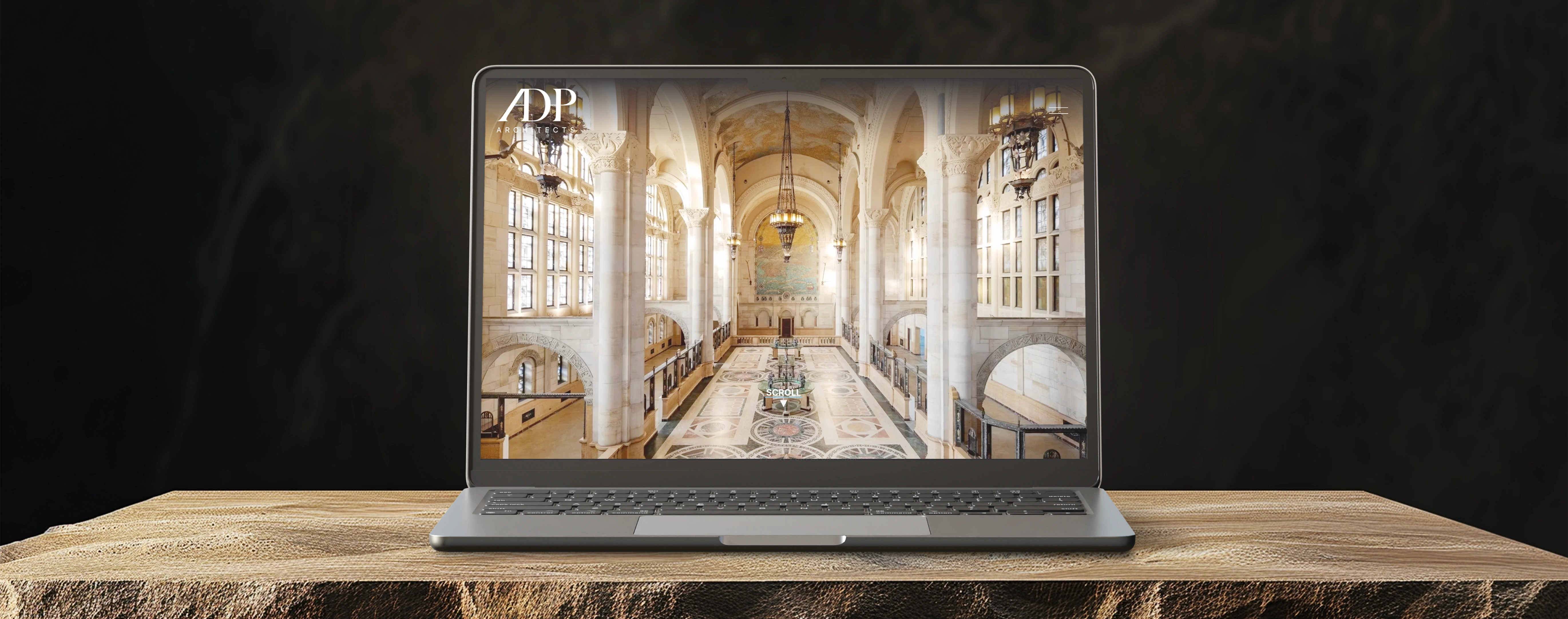 ADP Architects website designed by UpSpring displayed on a laptop showing a grand vaulted interior with ornate columns and mosaic floors