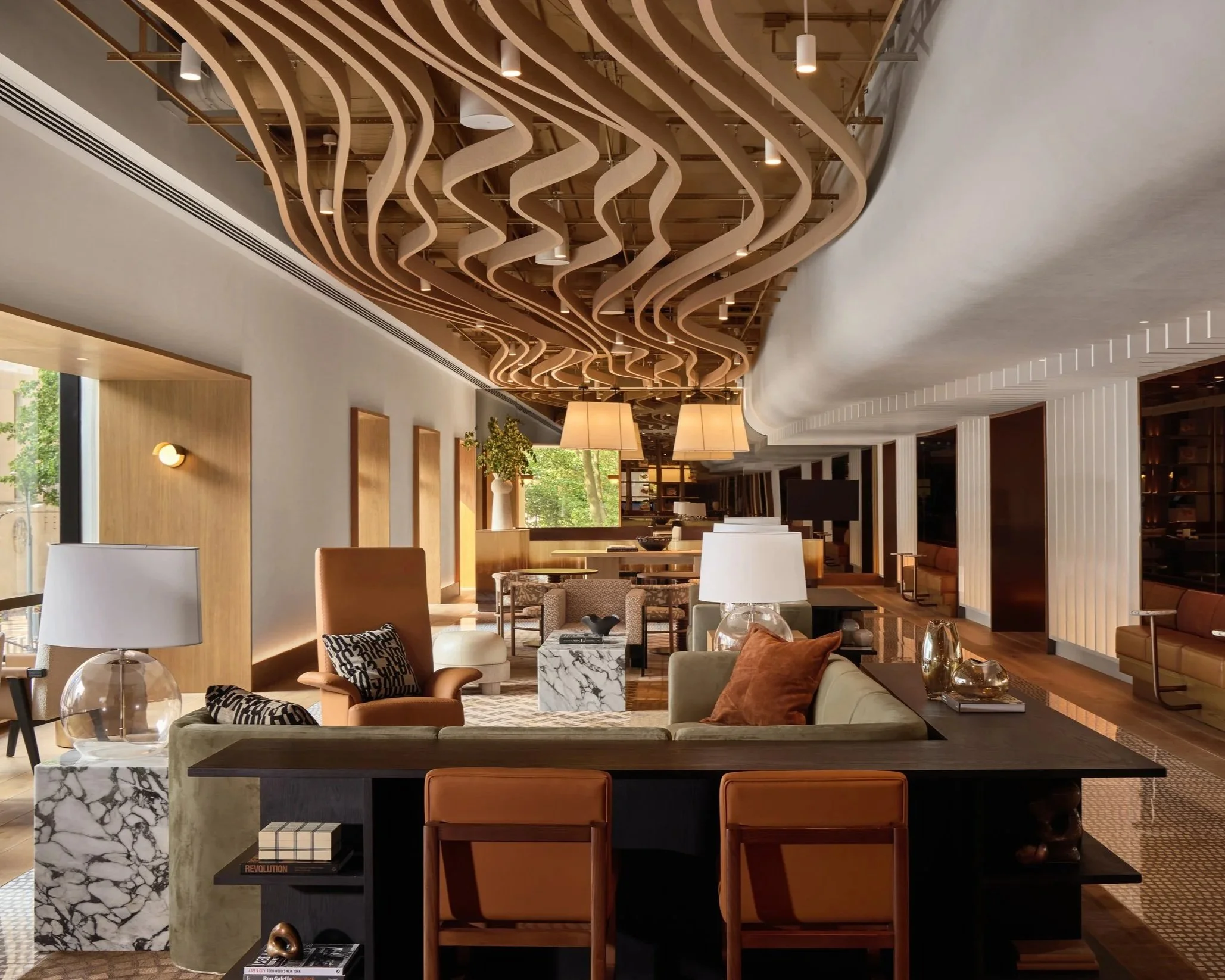Mazzarini & Co interior design for The Maybury, featuring a sculptural wavy wood ceiling above a lounge seating area