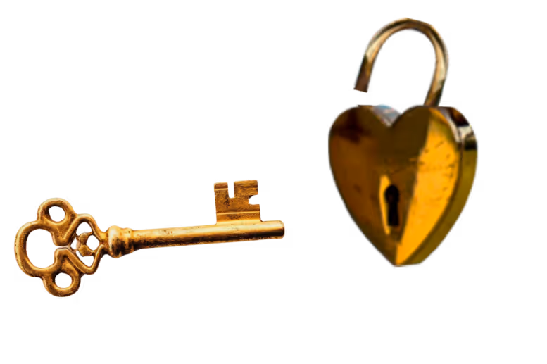 Vintage golden heart-shaped lock with ornate antique key beside it
