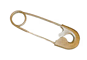 Vintage golden safety pin with curved ornate design on white background
