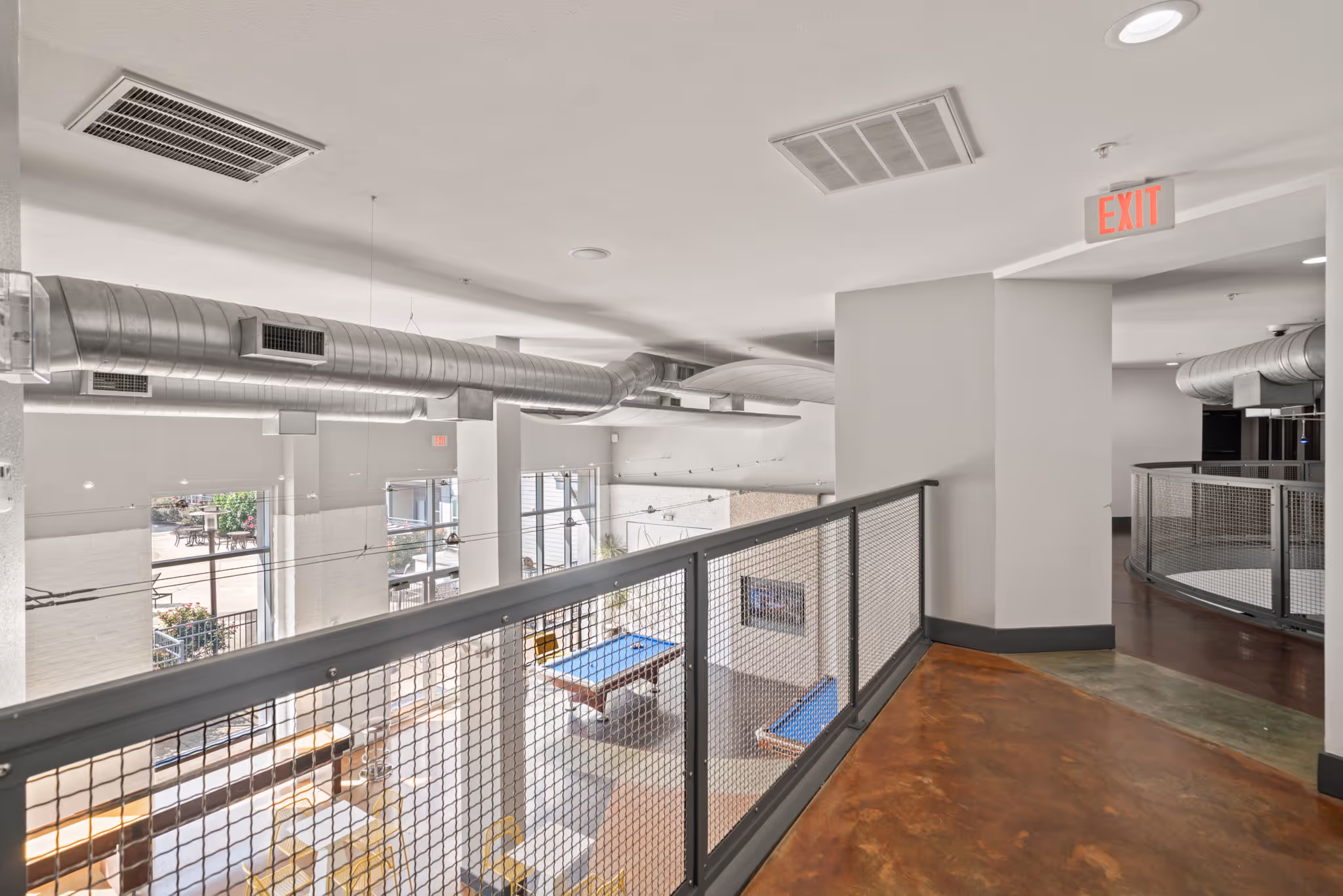 Elevated view of the resident clubhouse at The Lofts at Wolf Pen Creek overlooking the game room.