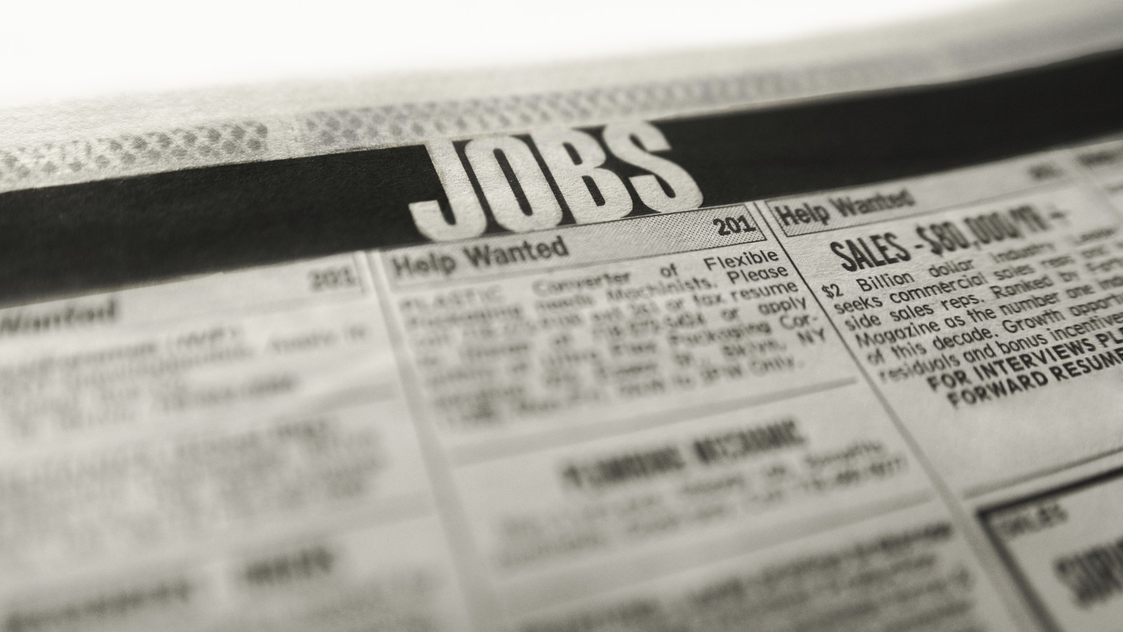 Close-up of a newspaper's job listings section.