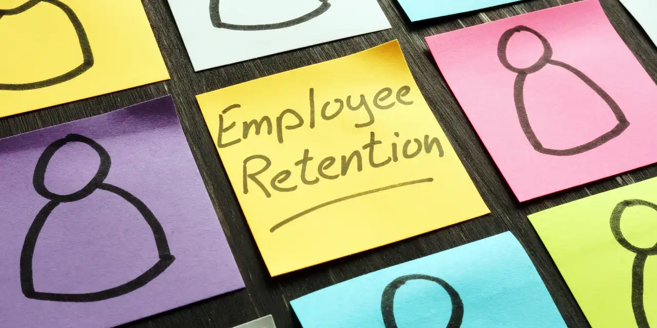 Sticky note with 'Employee Retention' written on it.