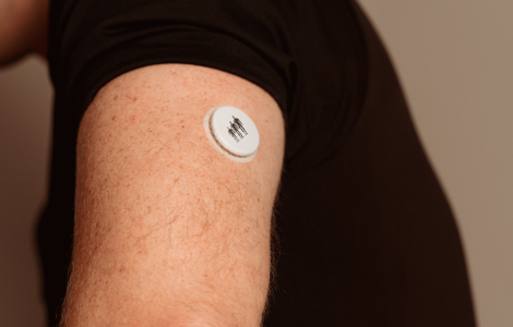 Man wearing a continuous glucose monitoring patch