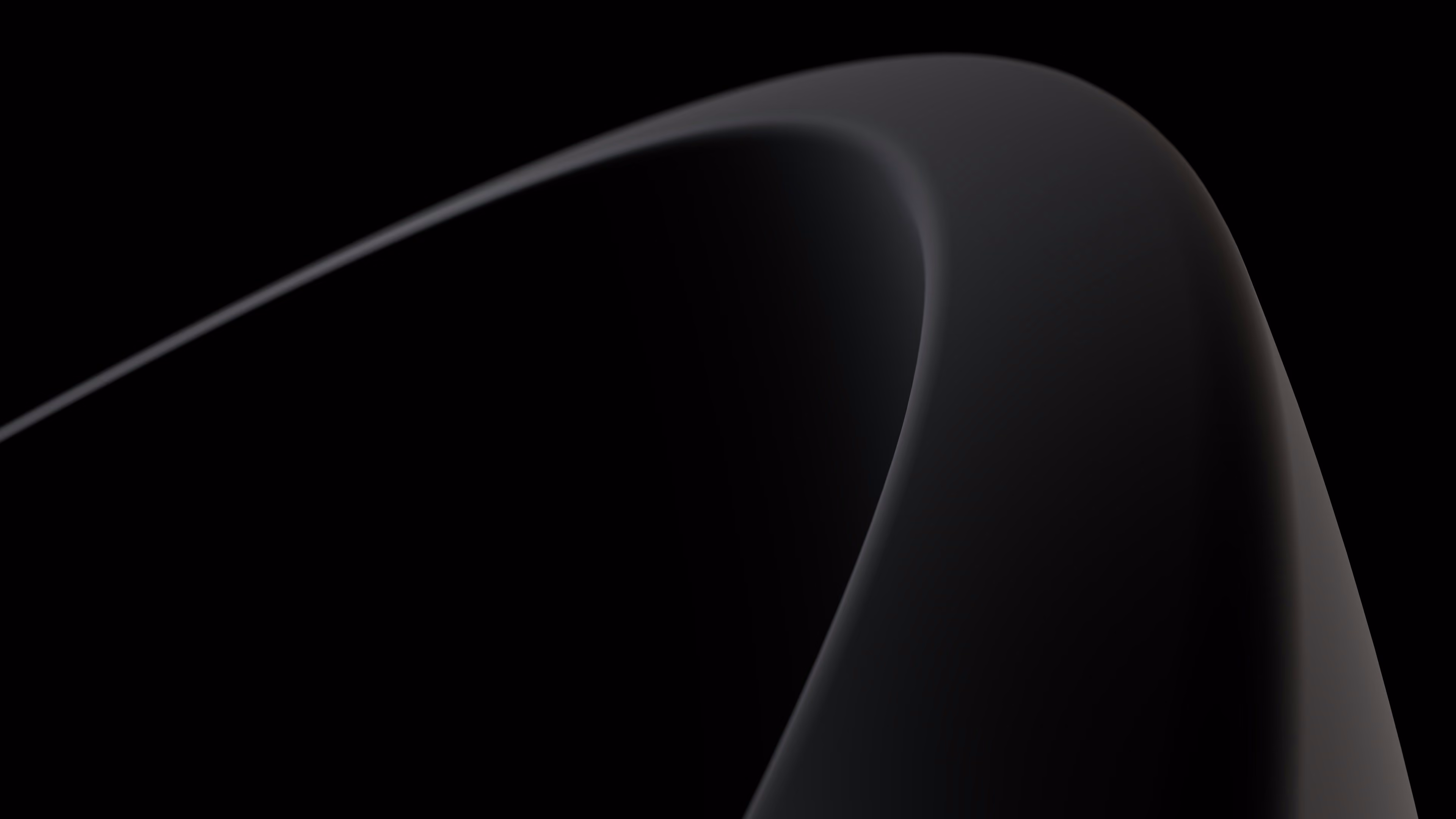 Smooth curved black shape with subtle highlights on a black background.
