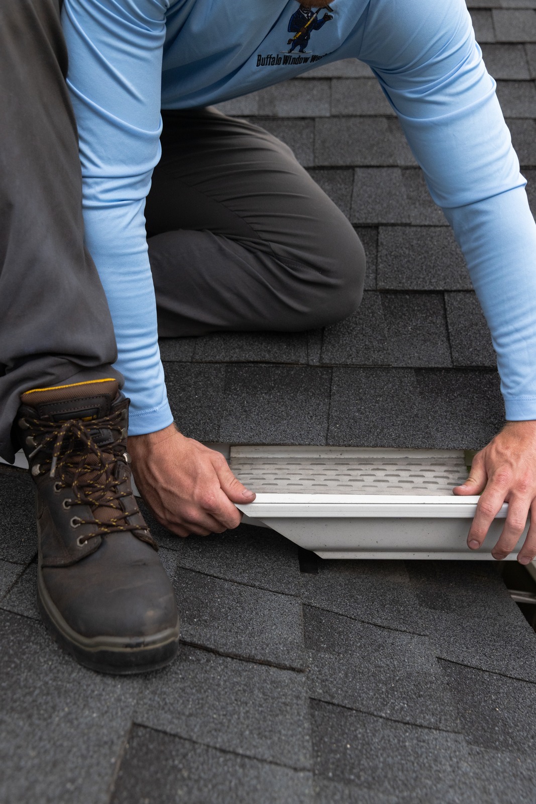 Technician working with gutter guard
