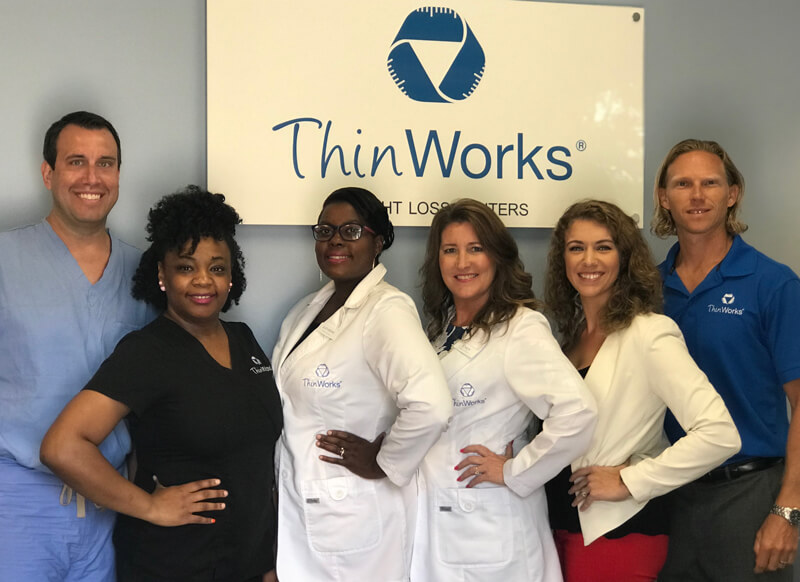 The entire Thin Works team standing together.