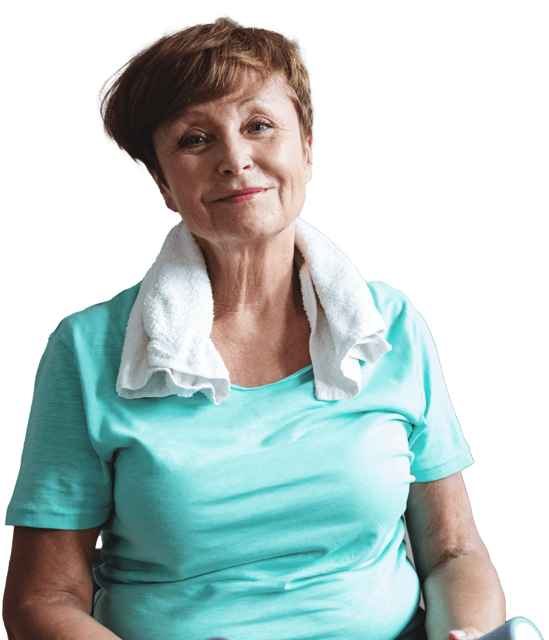 Happy and content  older woman with a towel around her neck.