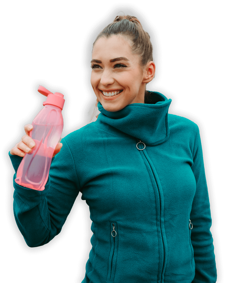 A woman drinking an electrolyte replenisher. 