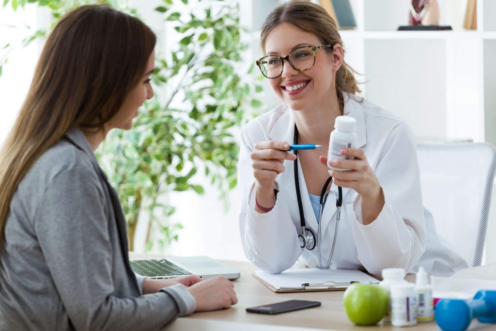 Female dietician prescribing nutritional supplement for patient in the consultation to Lose Weight in Palm Beach Gardens