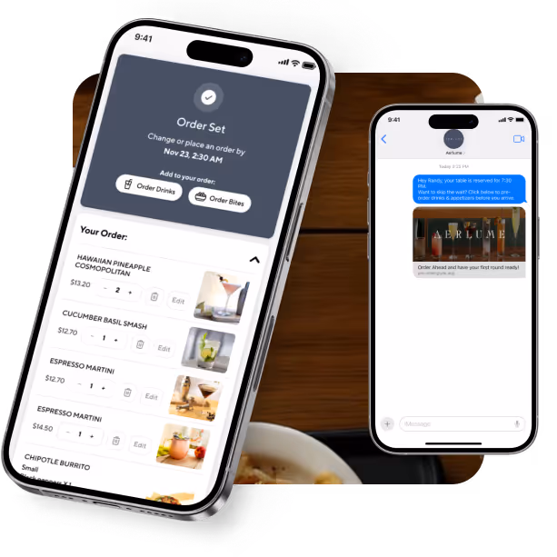 Two smartphones displaying a restaurant order app and a text message reservation confirmation on a wooden table.