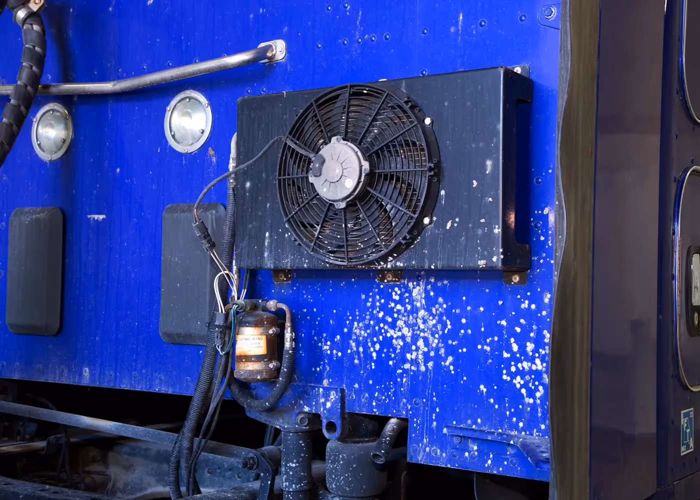 Mobile diesel mechanic performing HVAC system repairs on heavy duty truck fleet in Ontario, California