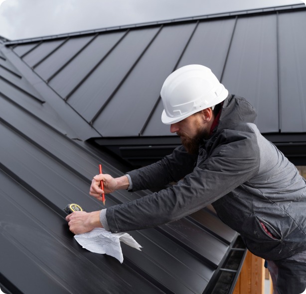 EcoShield Exteriors roofing expert taking measurements for a new Denver roof installation